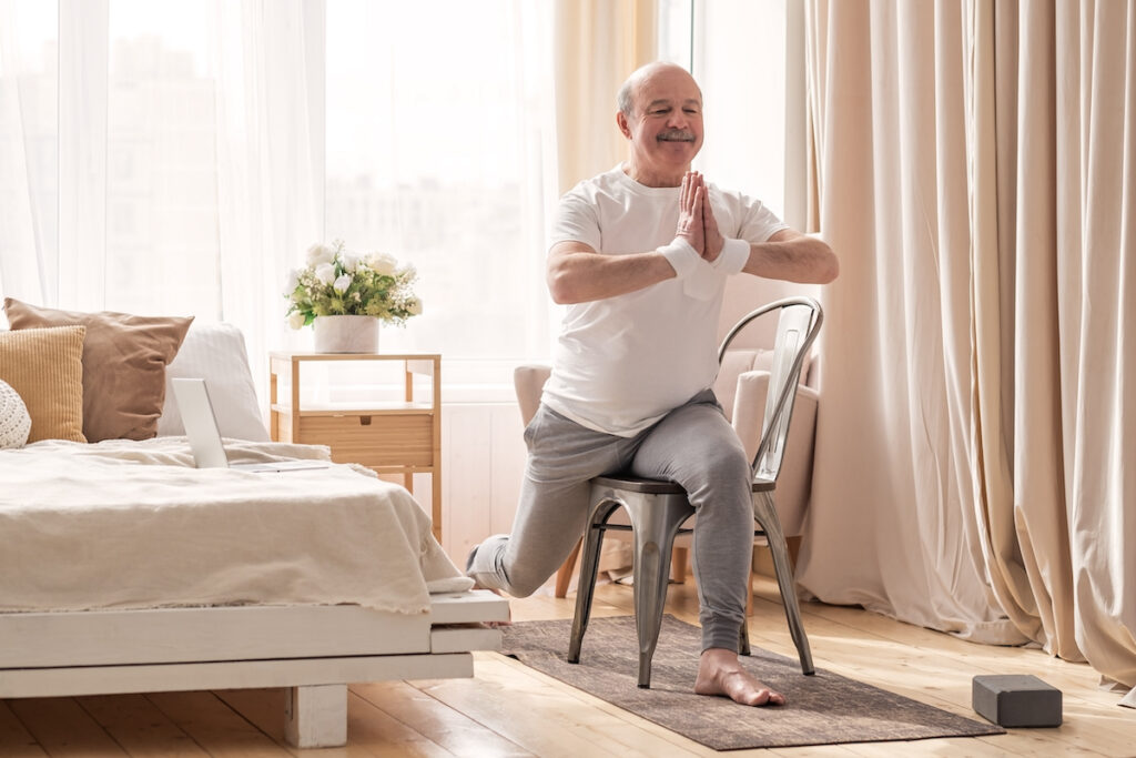 Elderly man practicing yoga