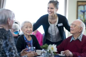 Team member greets senior living residents
