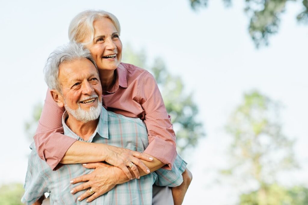 Couple of older adults hugging each other