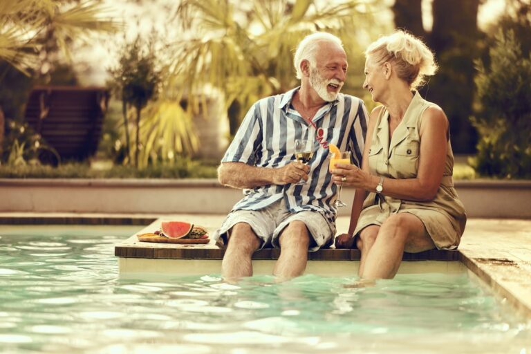seniors enjoying time with each other by the pool