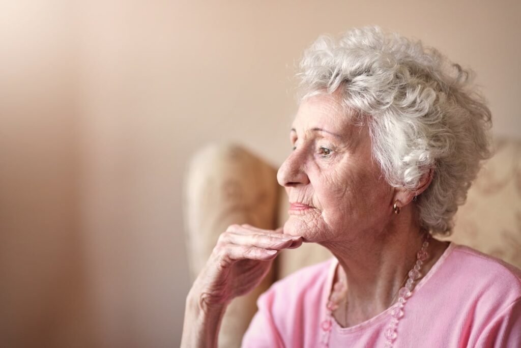 Woman with dementia thinking about memory care options