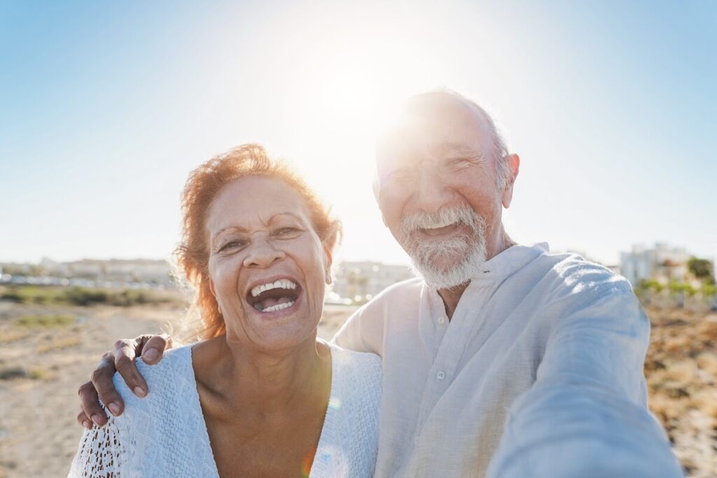 Joyful couple of older adults living in senior living in Florida