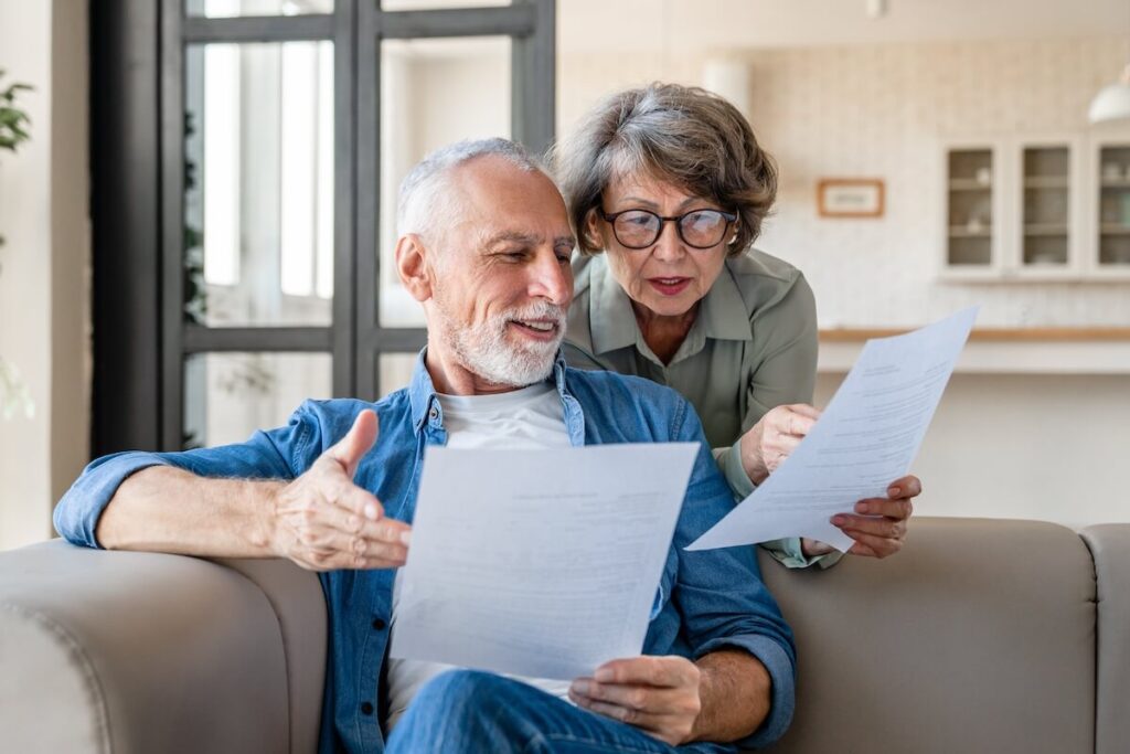 A couple of older adults comparing prices of senior living in Florida