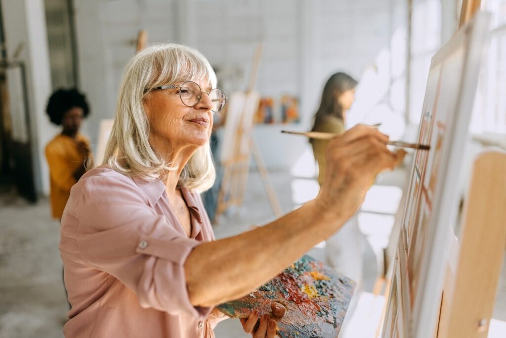 Senior lady paints