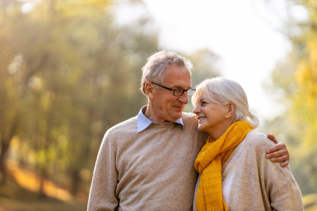 Older adults hugging each other