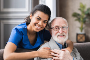 Caregiver hugging an older adult