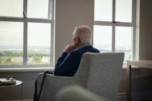 An older adult being affected by Seasonal Affective Disorder