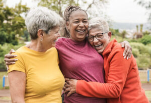 Group of senior women hugging each other